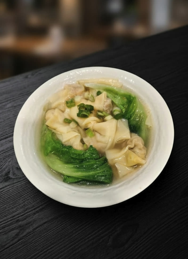 You Yi’s Cantonese wontons in broth with bok choy — styled presentation of the restaurant’s dish.